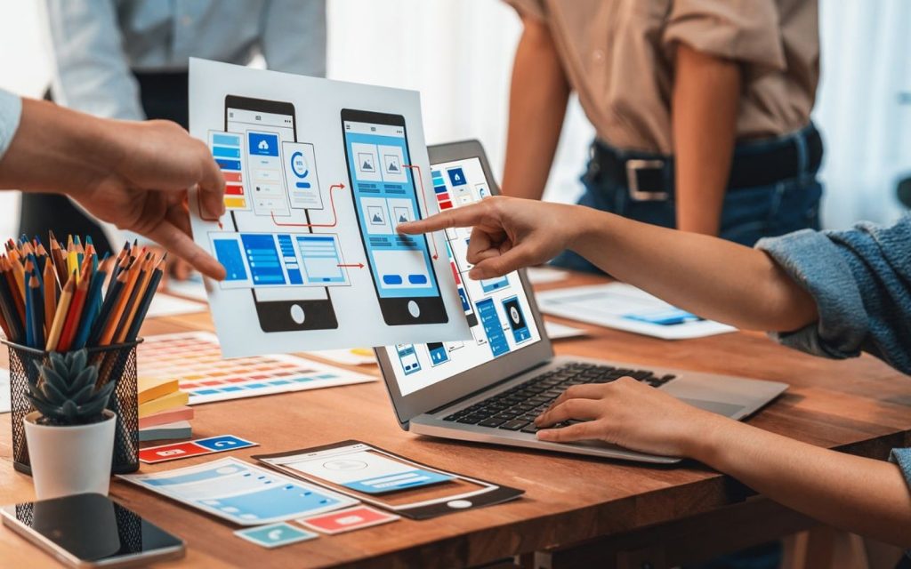 Creative team collaborating in a UX design brainstorming session