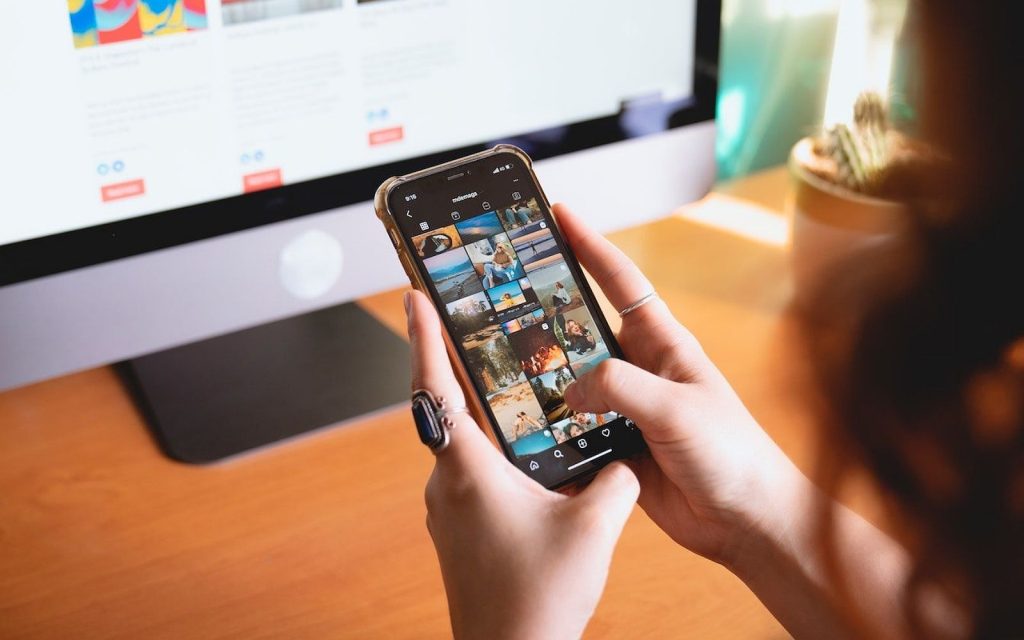 Young person watching TikTok and Instagram Reels on smartphone